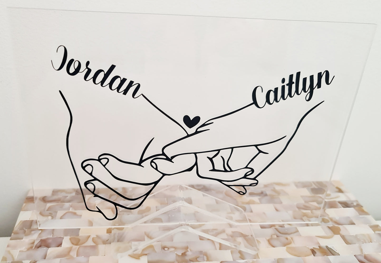 "Couple holding hands" plaque