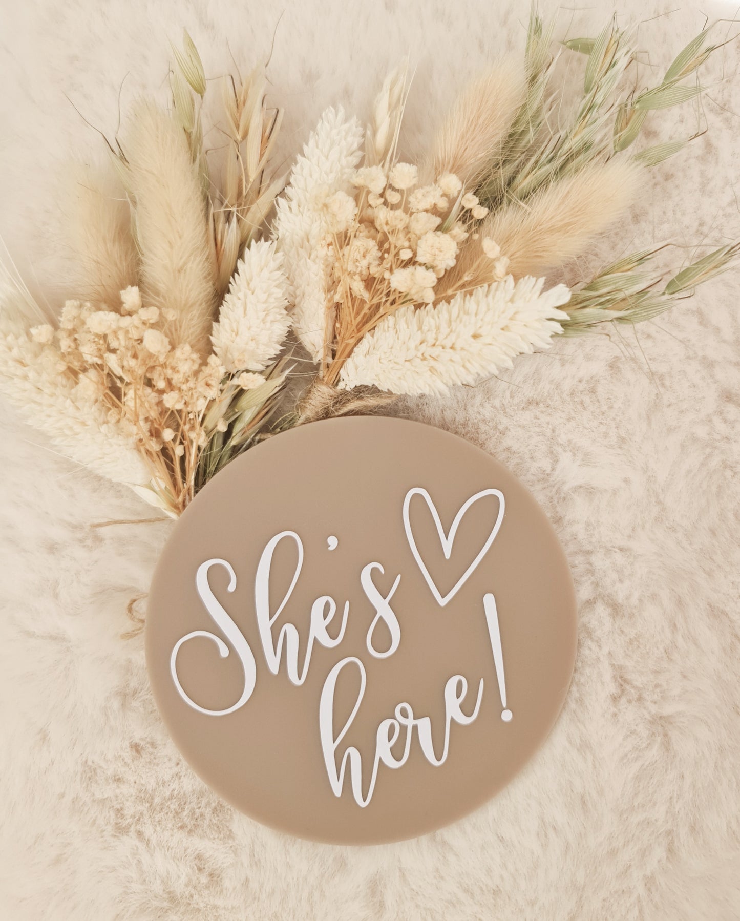 "She's here" milestone plaque