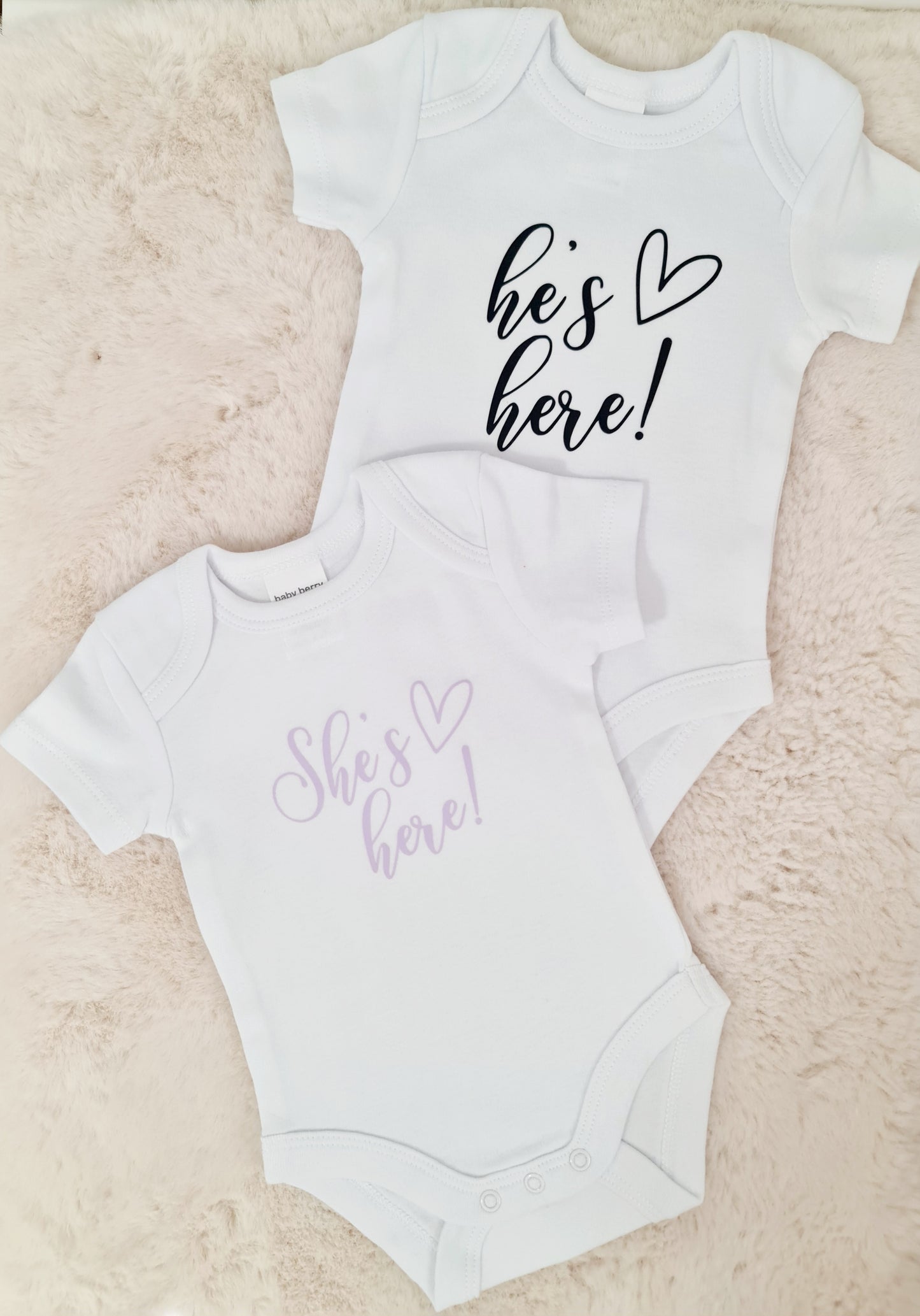 "He's here" baby announcement onesie