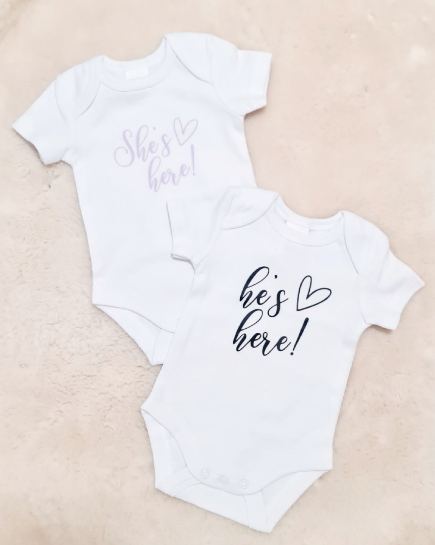 "He's here" baby announcement onesie