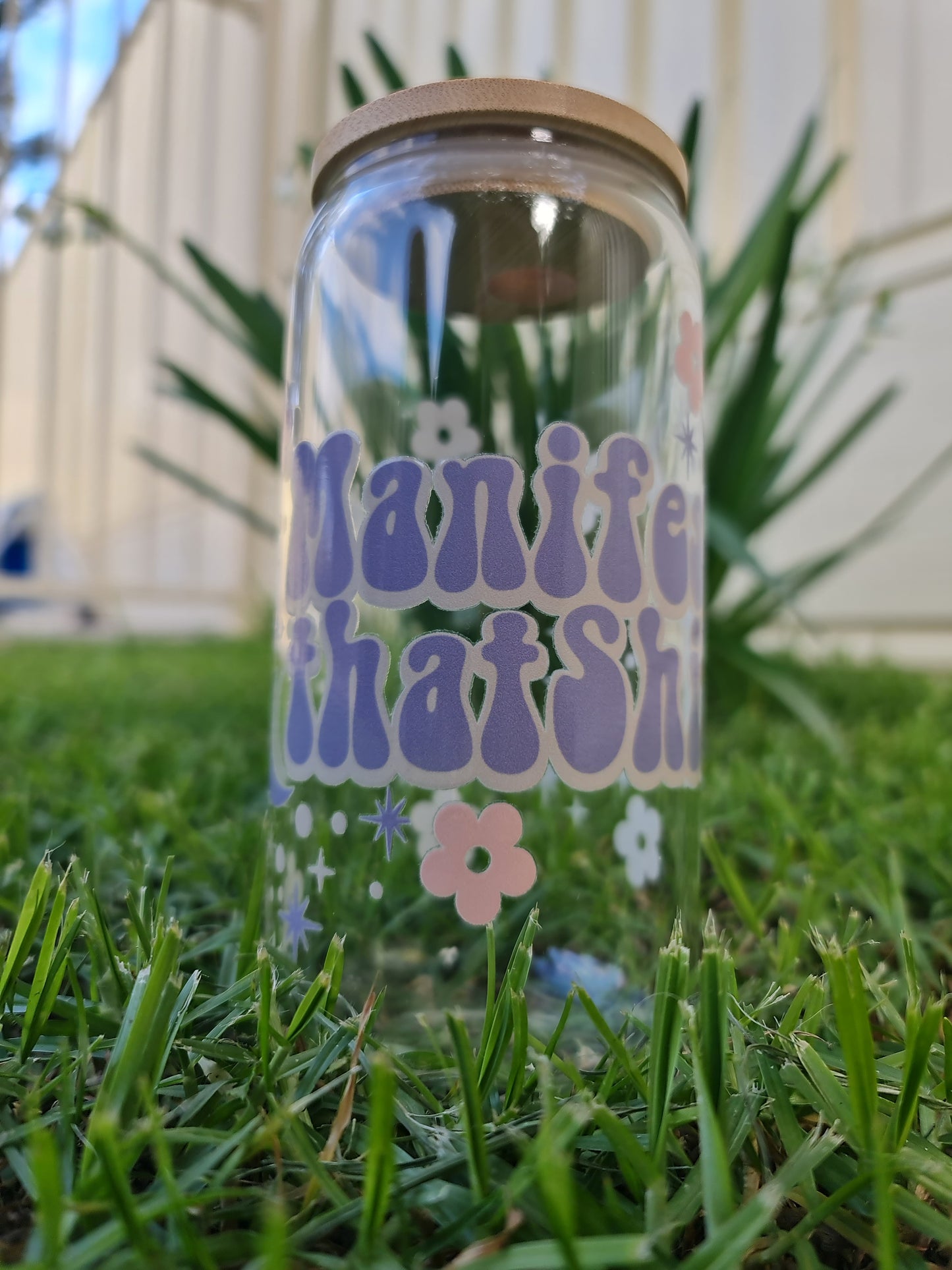 "Manifest that ..." glass cup