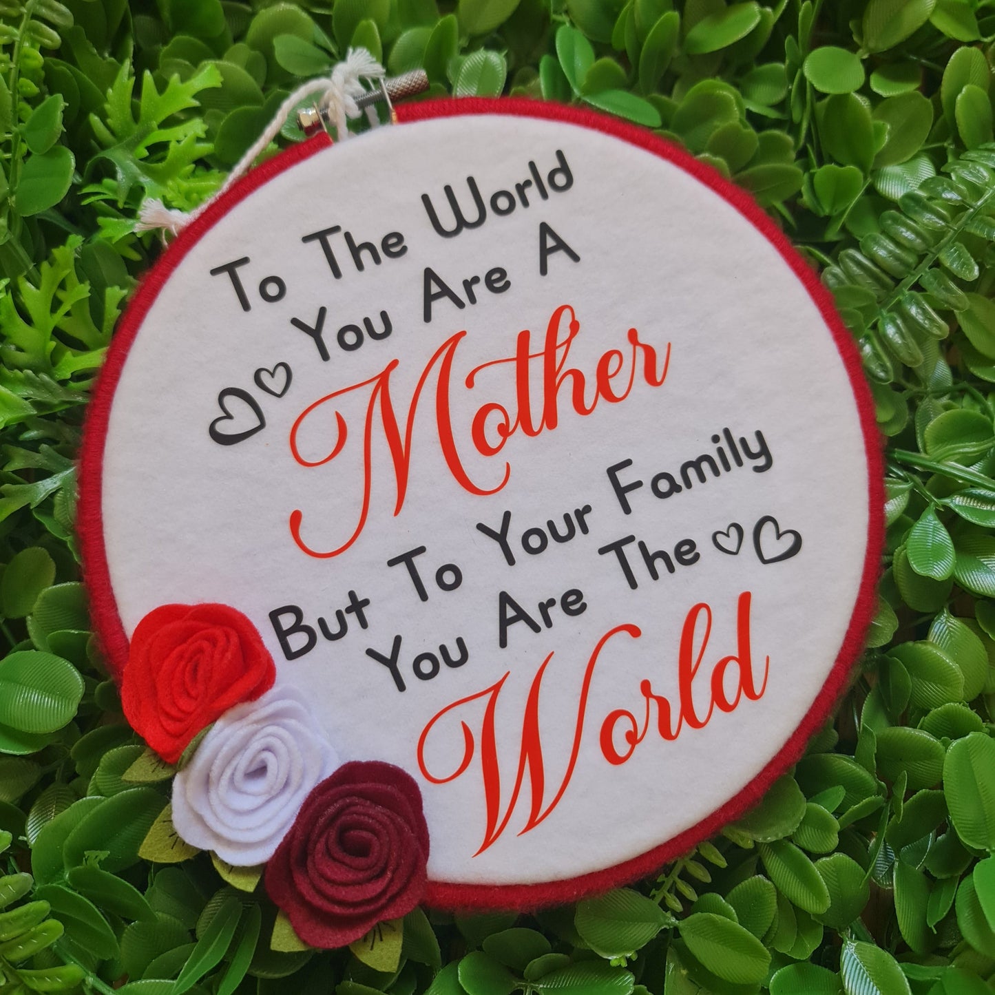 Decorative patch with text and roses on a green leaf background