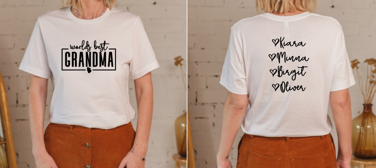 White t-shirt with 'World's Best Grandma' on front and personalized names on back, worn by a person.