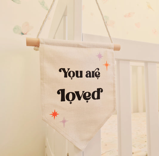 "You are loved" hanging banner