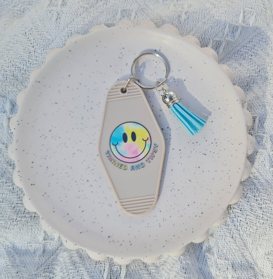 Tanned and tipsy motel keychain (white)