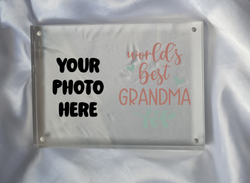Personalized photo frame with 'World's Best Grandma' text on a satin background