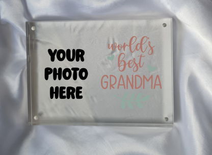 Personalized photo frame with 'World's Best Grandma' text on a satin background