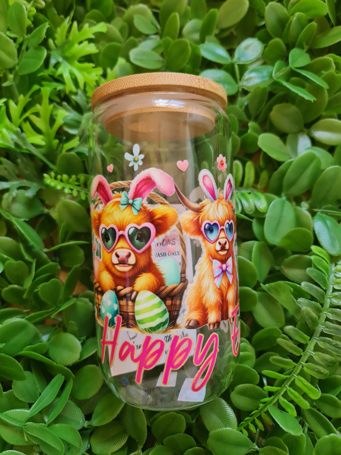 Tumbler with cartoon character design on a green leaf background