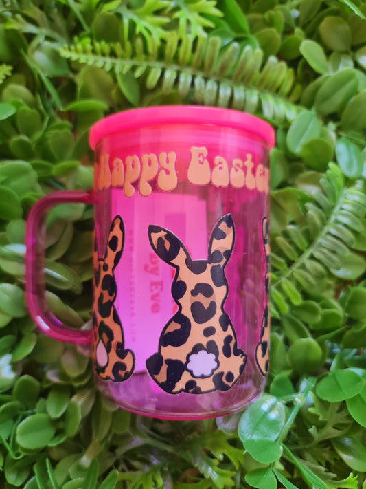 Pink container with leopard print design and 'Happy Easter' text on green leaves